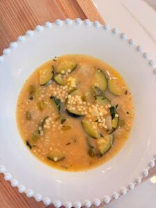 A bowl of Nonna's Penicillin Soup with zucchini and pastina